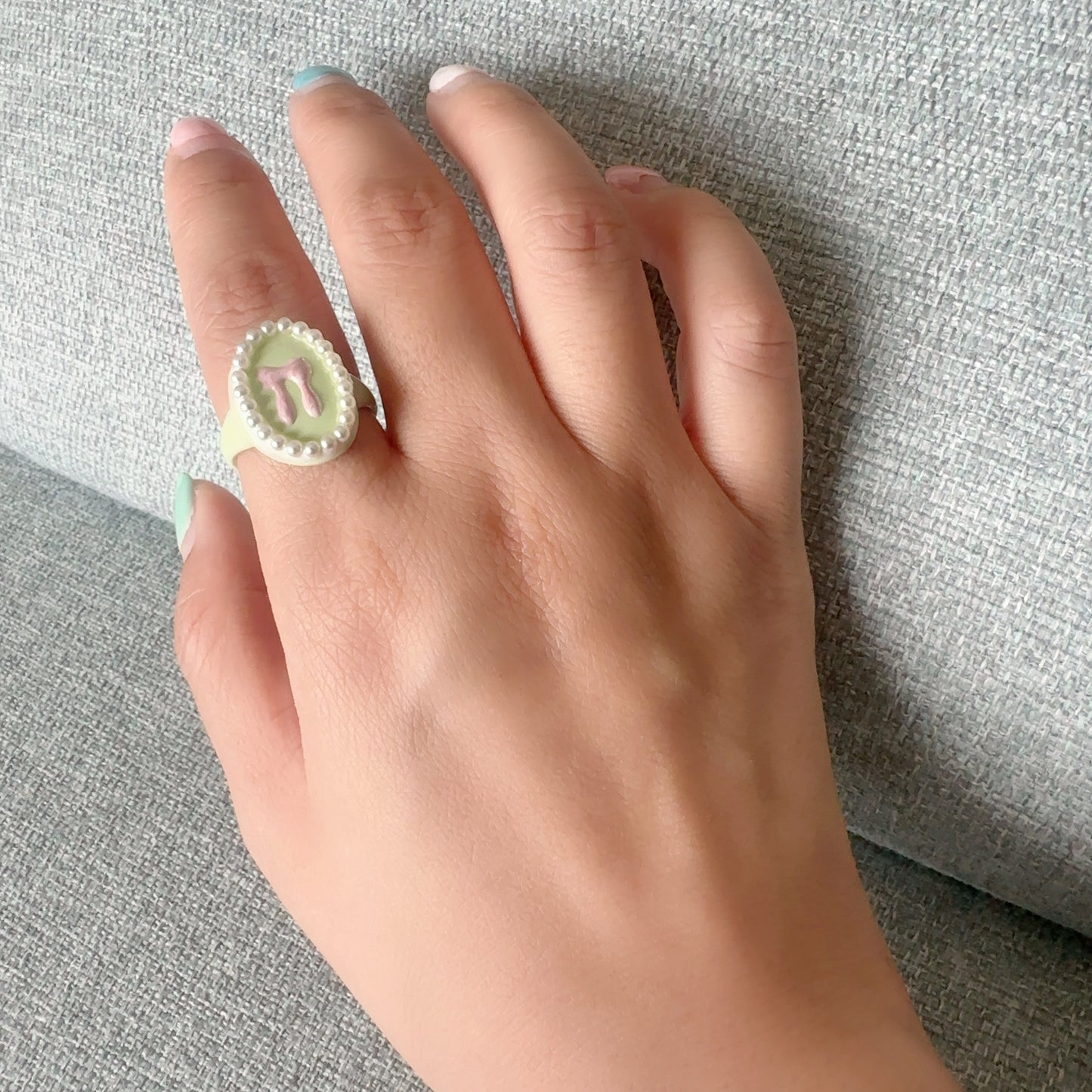パールフレームリボンリング